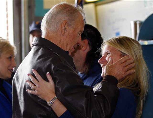 Biden "comforts Kim Samarelli during a visit to the Seaside Heights Volunteer Fire Department"
